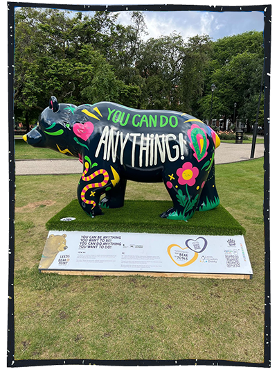 Black polar bear statue decorated with colourful paint by the RE team and displayed in Future Minds Festival