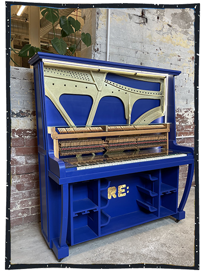 Piano upcycled by RE painted bright royal blue colour with internal tune parts display
